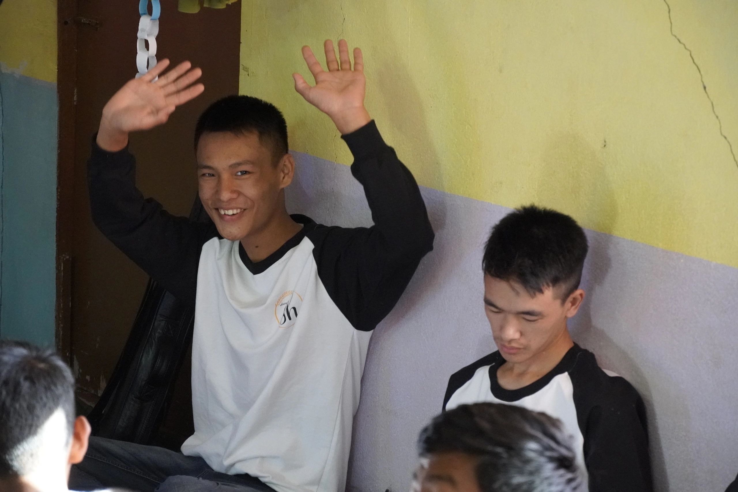 Young man raising hands in worship